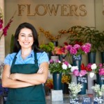 Woman standing outside florist